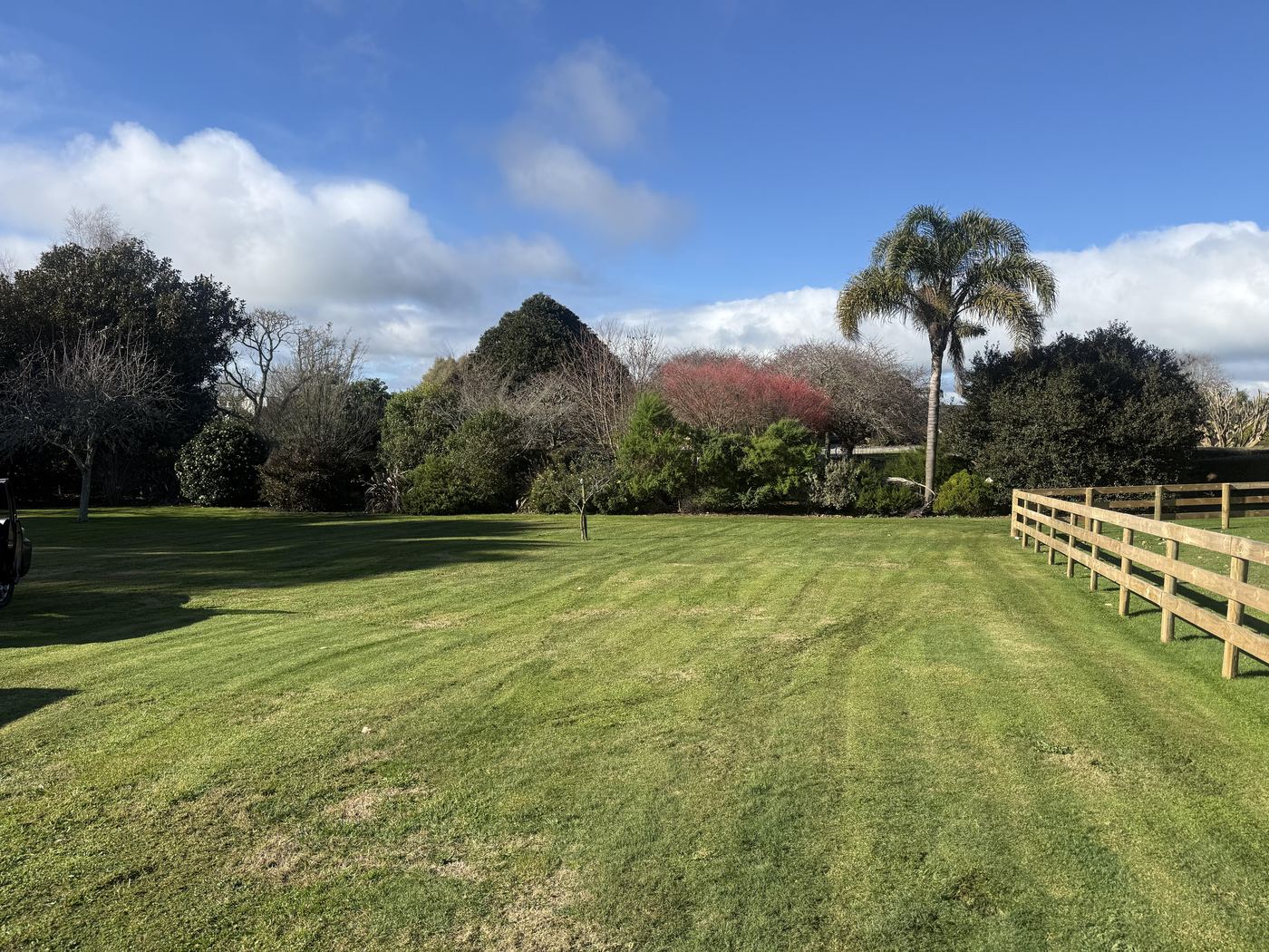 Large fenced property lawn mowed by JR Lawn Mowing